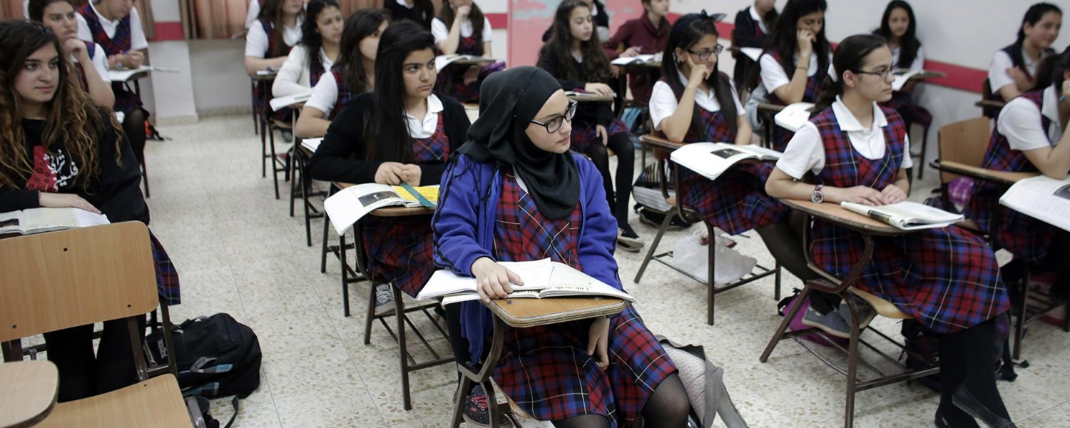 Classroom of Palestinian students in uniforms at Rosary Sisters School in Beit Hanina