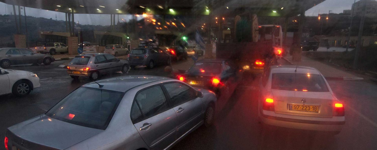 Cars and busses queue at the Qalandiya Israeli checkpoint leading from Ramallah into Jerusalem.