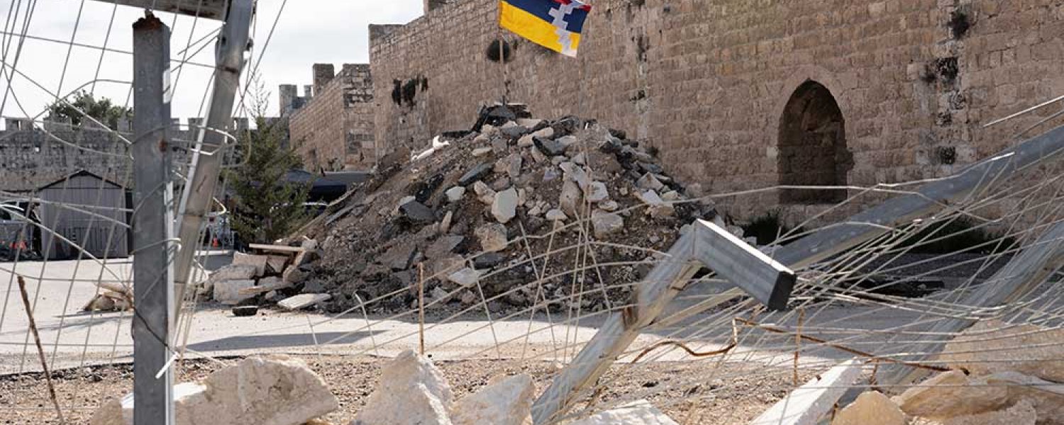 The Armenian flag flies atop a pile of rubble in the Cows’ Garden lot in the Armenian Quarter, Jerusalem, December 23, 2023.