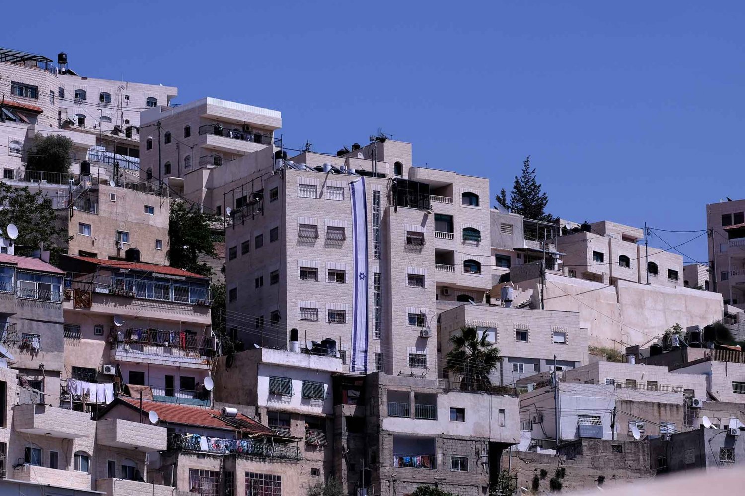 Building with the Israeli flag on it, which Jewish settlers acquired in the Silwan neighborhood, Jerusalem, April 2016