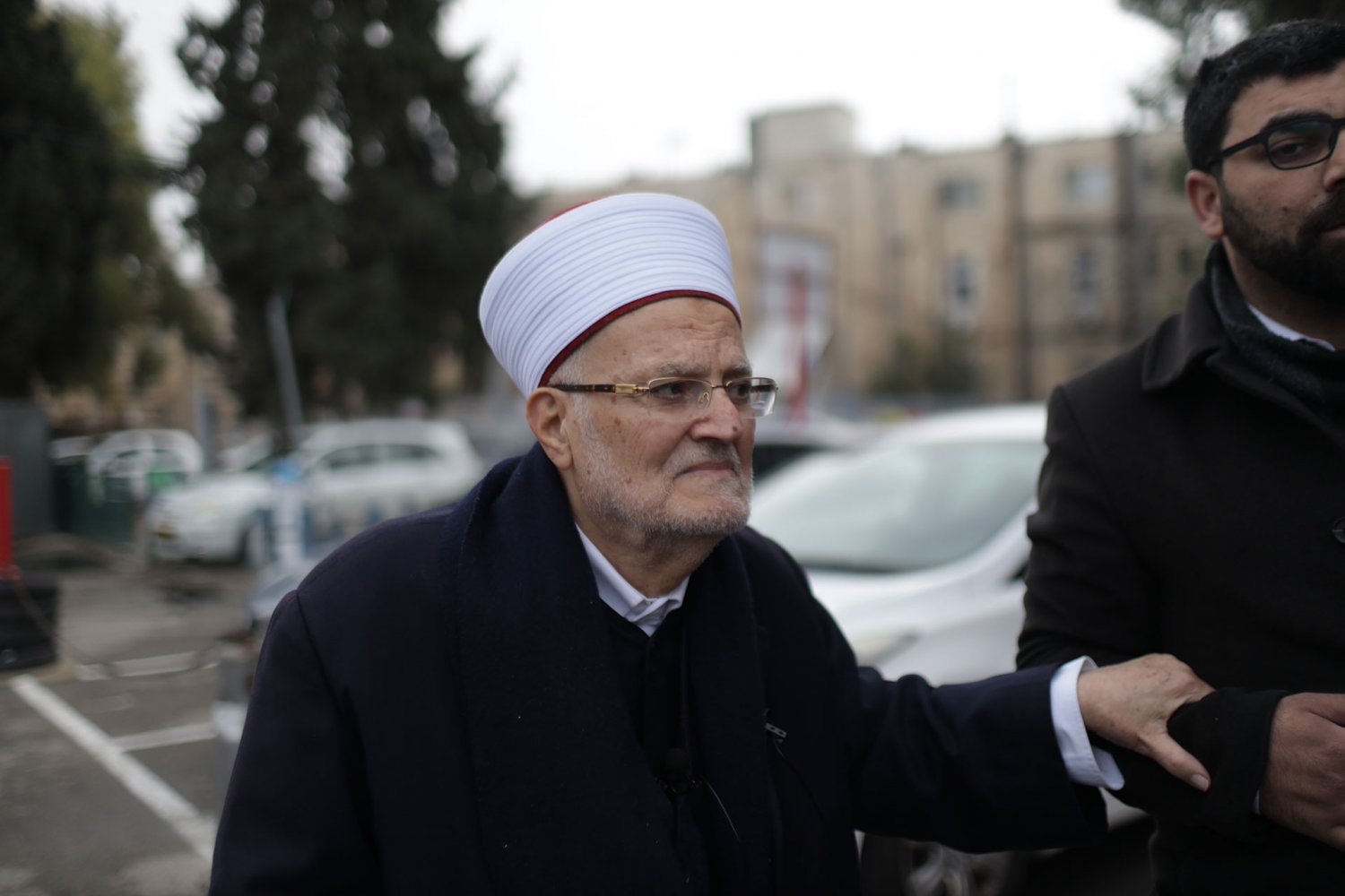 Sheikh Ekrima Sabri walks outside an Israeli police station after being summoned for interrogation, January 2, 2023.