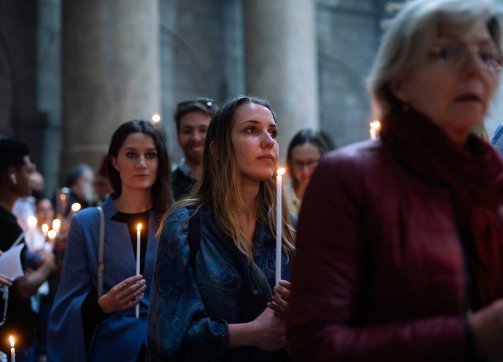 Worshippers holding candles during on Easter at the Church of the Holy Sepulchre, March 31, 2024.