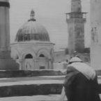 An old Palestinian man walks toward the al-Aqsa Mosque in Jerusalem to pray, May 1967 (UNRWA footage).