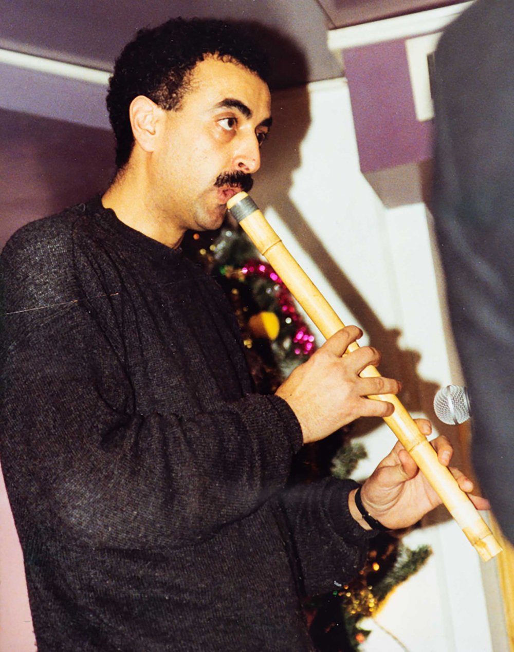 Said Murad playing the flute in a performance held at Al Kasaba Theatre, Ramallah, 1994