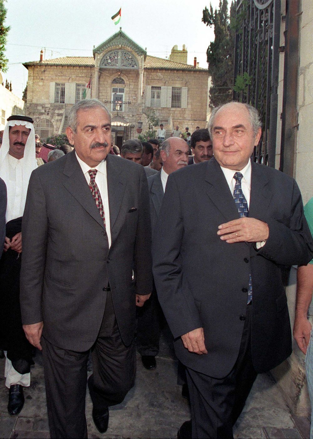Jordanian parliament speaker Abdelhadi al-Majali (left) and top Palestinian Liberation Organization (PLO) representative in Jerusalem Faisal Husseini (right) walk out of Orient House, the PLO’s unofficial headquarters in Jerusalem, October 6, 1999.