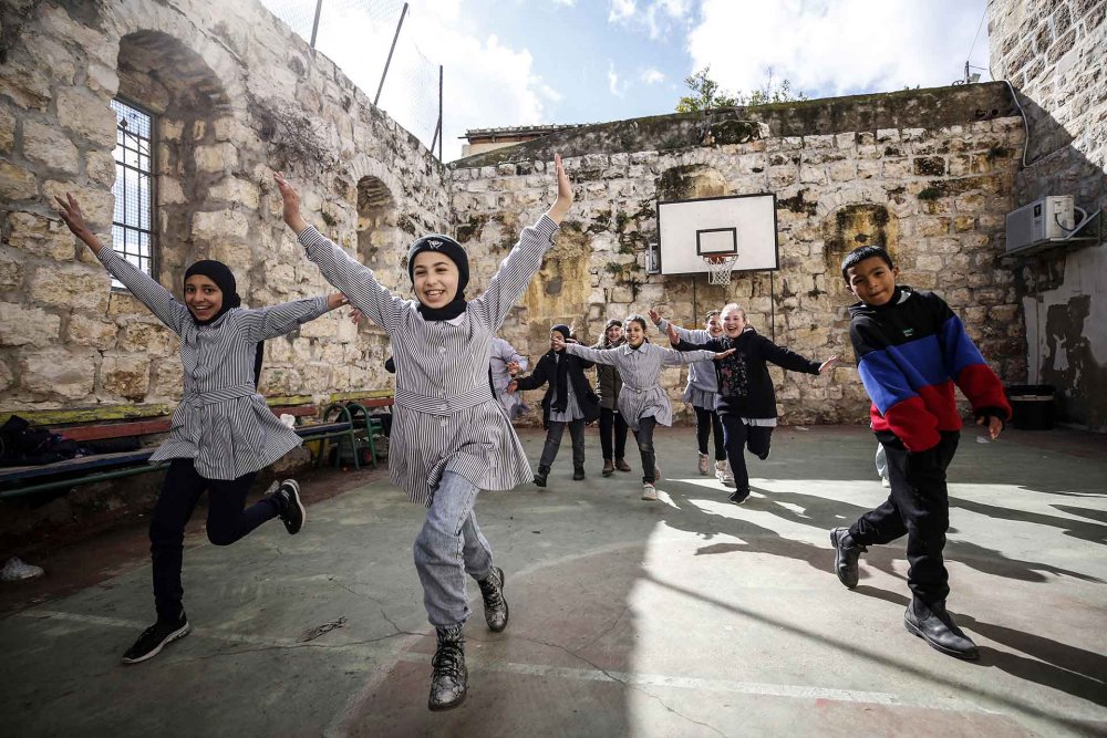 Palestinian children play at an UNRWA school in Silwan, Jerusalem, January 30, 2024.