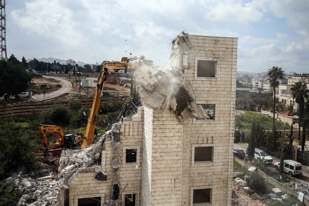 Israeli forces demolish a Palestinian home in Beit Hanina, East Jerusalem, February 20, 2024.