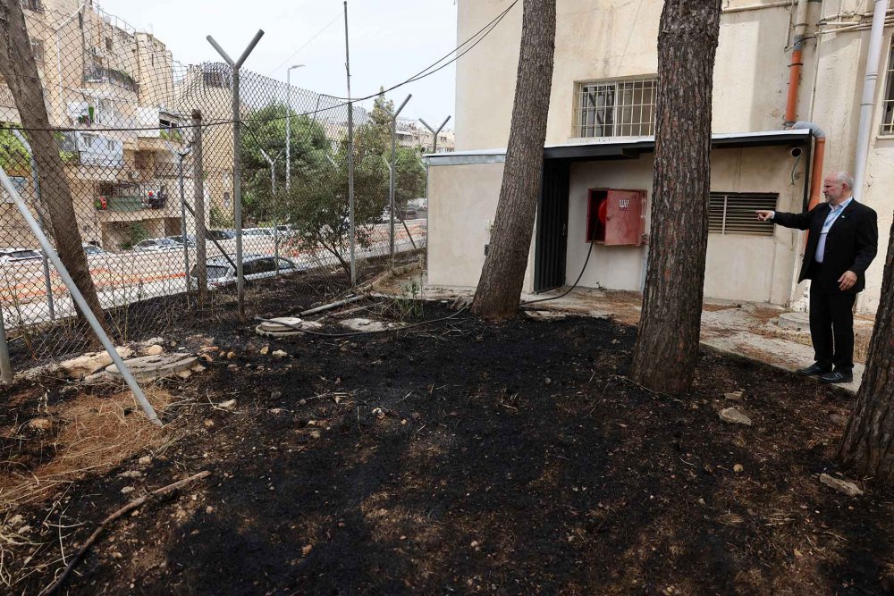 UNRWA director in the West Bank Adam Bouloukos views the effects of arson by Israeli settlers at UNRWA headquarters in East Jerusalem, May 10, 2024.