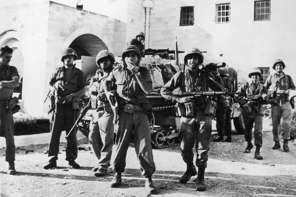 Israeli soldiers stand outside the UN headquarters in Jabal Mukabbir, East Jerusalem, after capturing it from the Jordanians during the 1967 War, June 8, 1967.