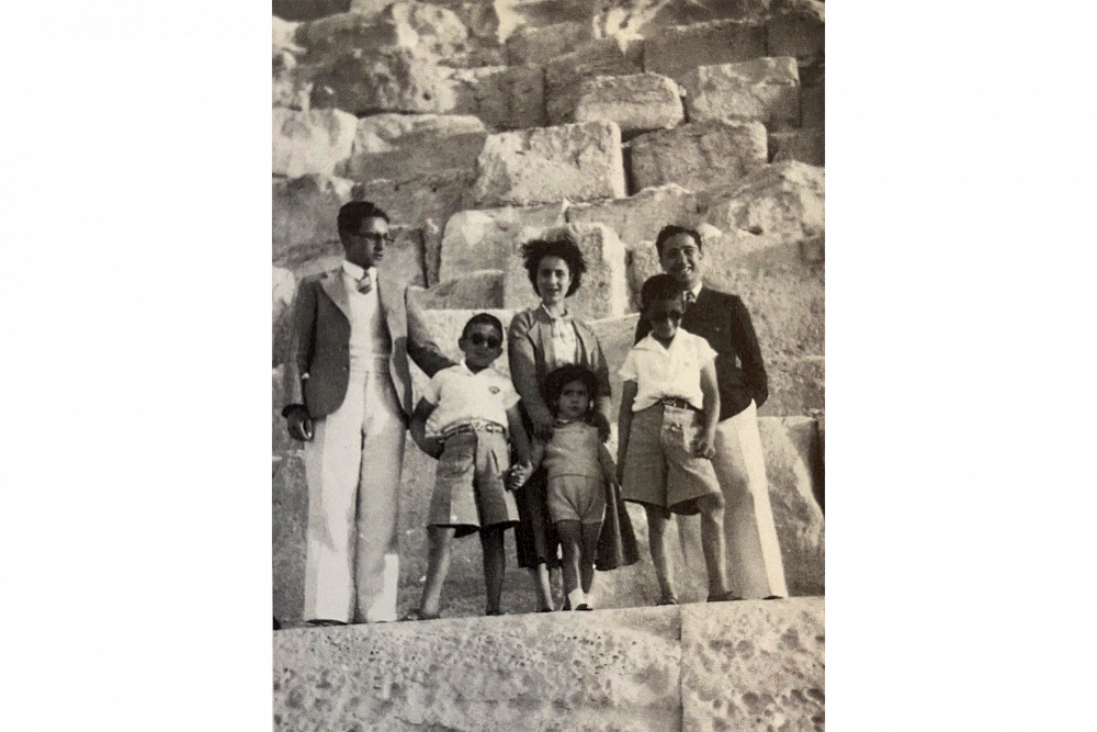 The Said siblings stand with their cousin Edward on a pyramid at Giza, Cairo, 1939