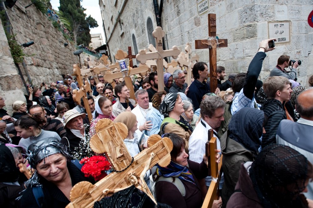 Orthodox Christian pilgrims carry crosses along the Via Dolorosa in Jerusalem’s Old City, commemorating the path Jesus carried his cross on the day of his crucifixion, April 22, 2011.