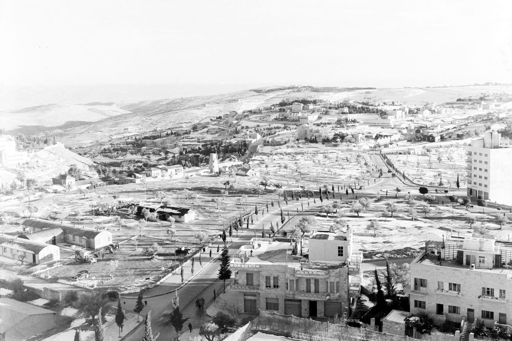 Snow covered hills south of Jerusalem showing residency in distance