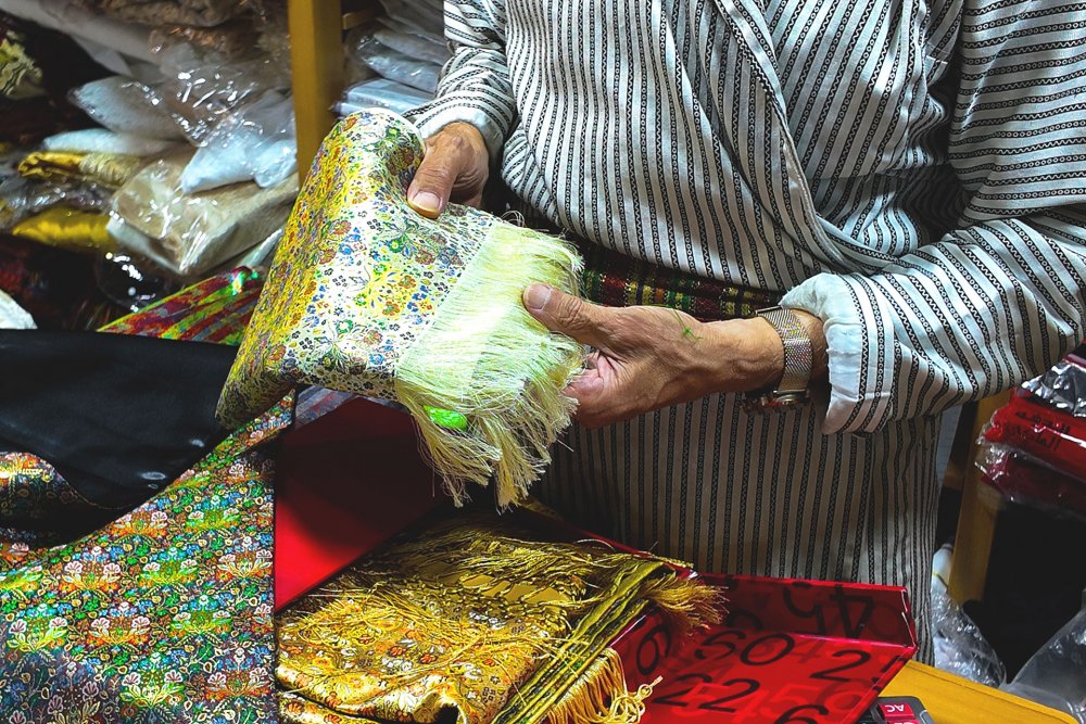 Gold on linen in Bilal Abu Khalaf’s shop, Jerusalem, July 22, 2024