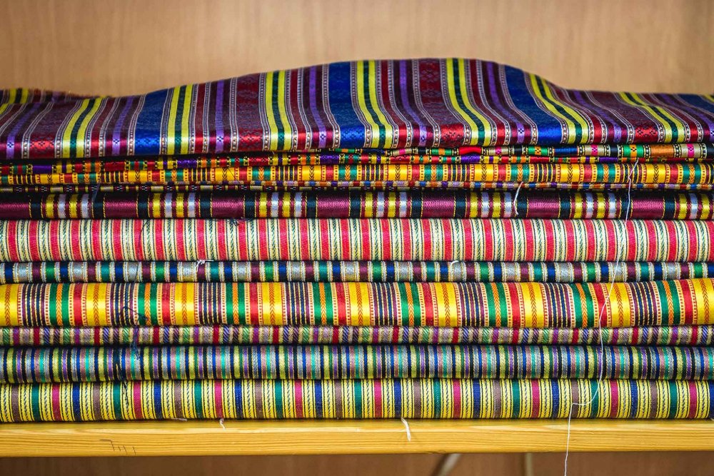 A shelf of fabrics at Bilal Abu Khalaf's store in Jerusalem’s Old City, October 22, 2015