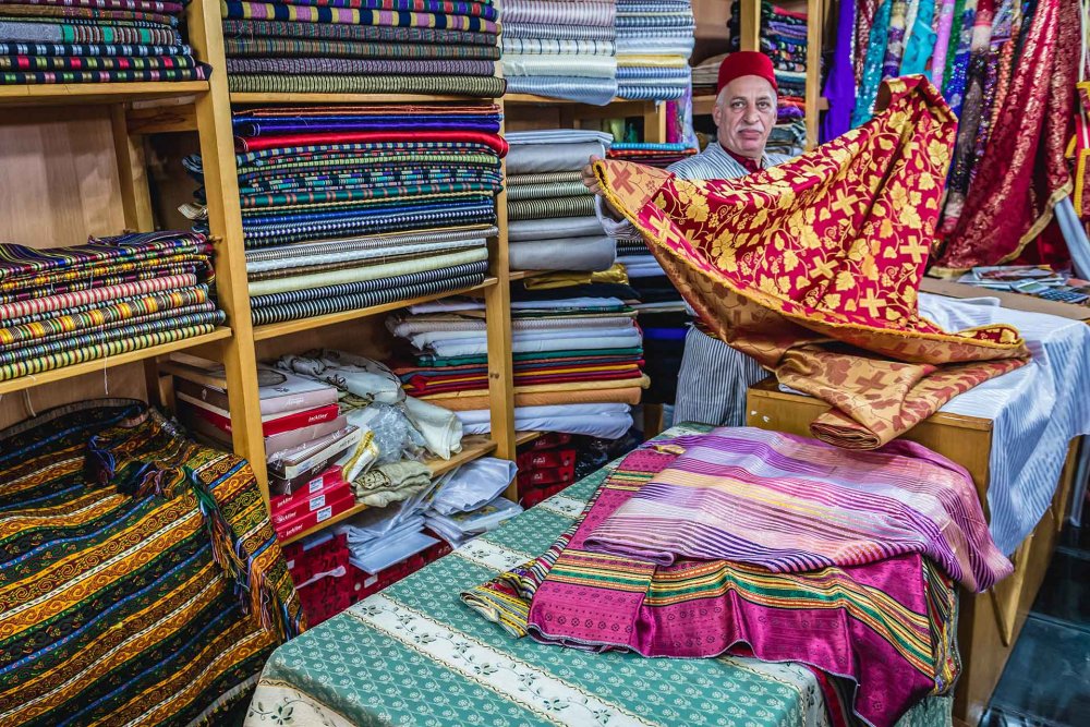 Bilal Abu Khalaf in his fabric shop, Jerusalem, October 22, 2015