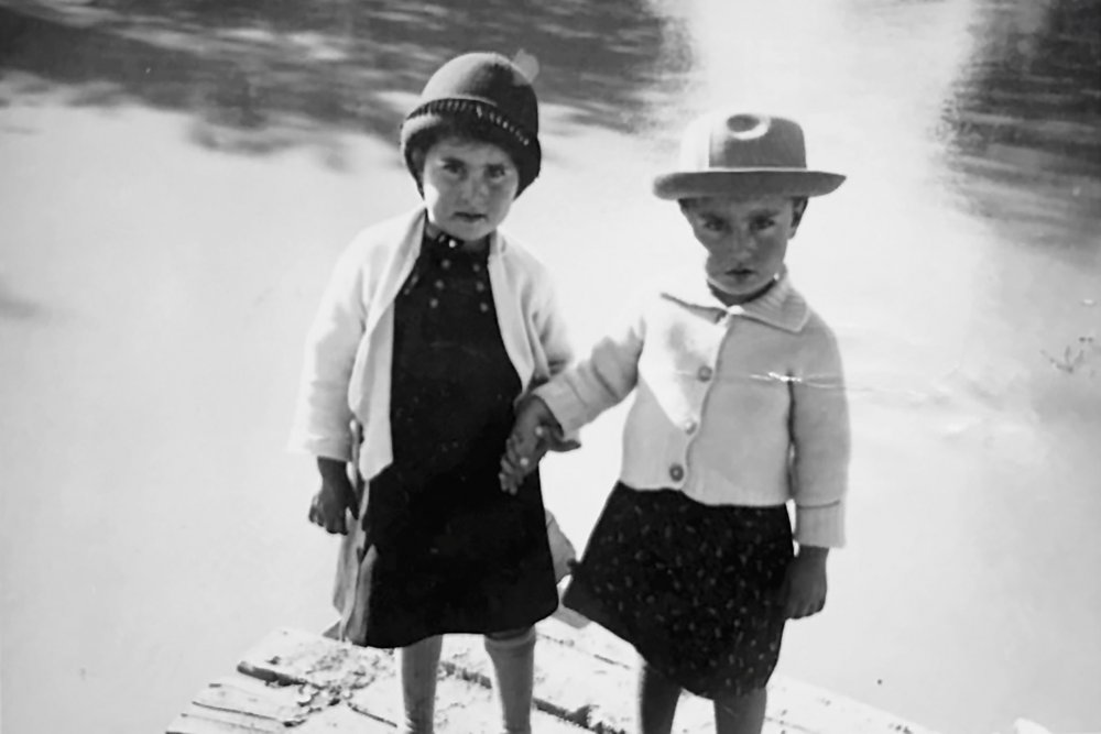 Two Palestinian toddlers holding hands and standing together in Jerusalem, before Israel was established 