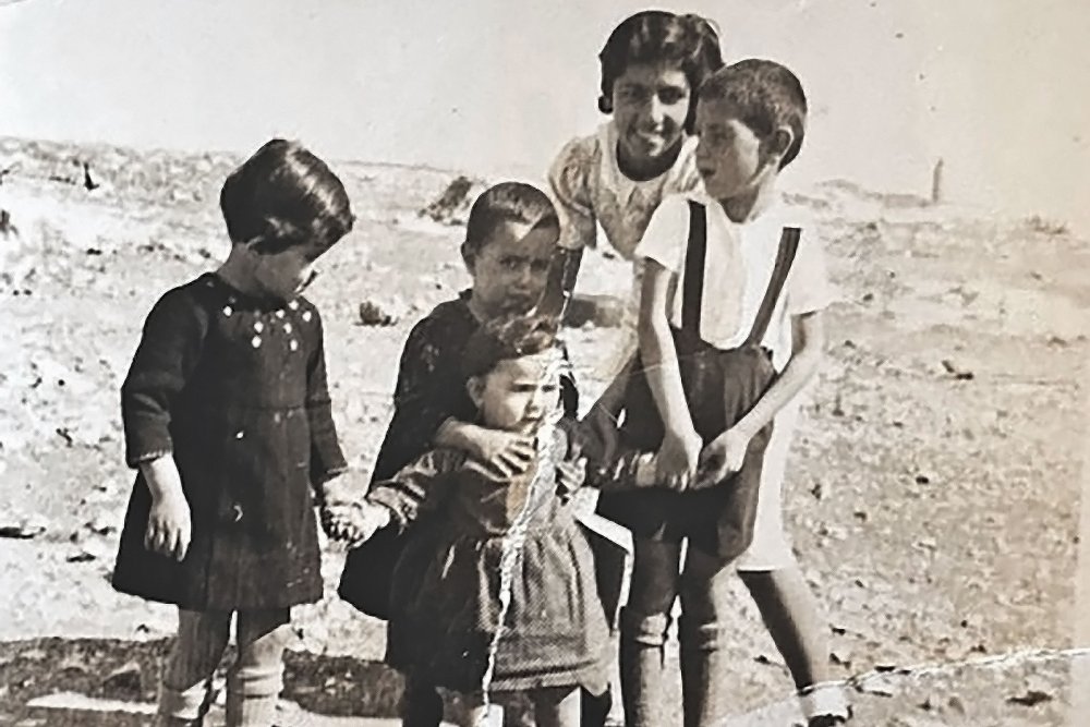 Four young Palestinians, Auntie M., her brother and sister, and two cousins, in Mamilla, Jerusalem, before Israel was established.