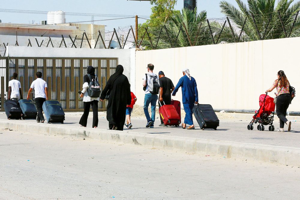 Pedestrian passengers arrive on the Jordanian side of the King Hussein Bridge crossing, July 19, 2022.