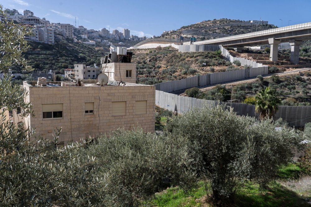 Israel’s Separation Wall snakes through the Palestinian neighborhood of Bir ‘Awna, walling it into Jerusalem.