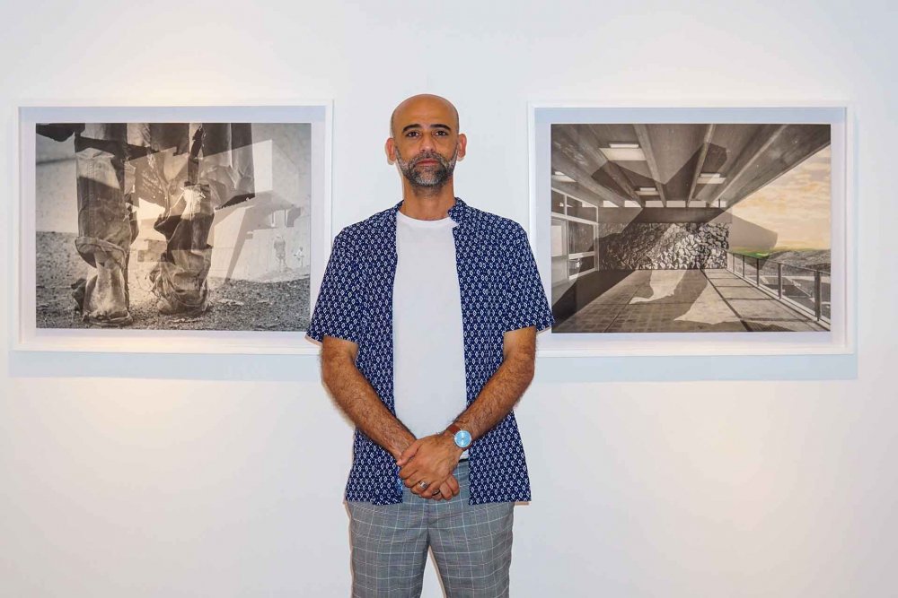 Palestinian artist Ahed Izhiman with two of his artworks at al-Hoash, Jerusalem, June 24, 2024