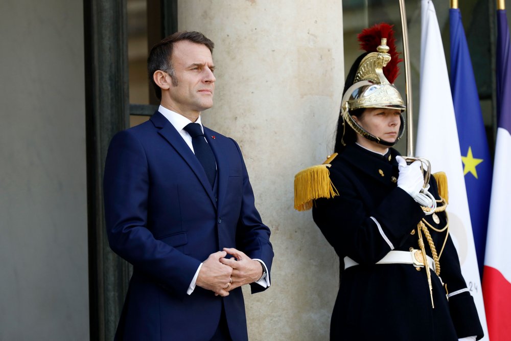  France's President Emmanuel Macron awaits the arrival of Ghana's President Nana Akufo-Addo