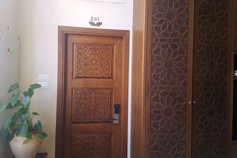 Engraved wooden doors on the guest rooms at the Jerusalem Hotel, East Jerusalem September 11, 2024