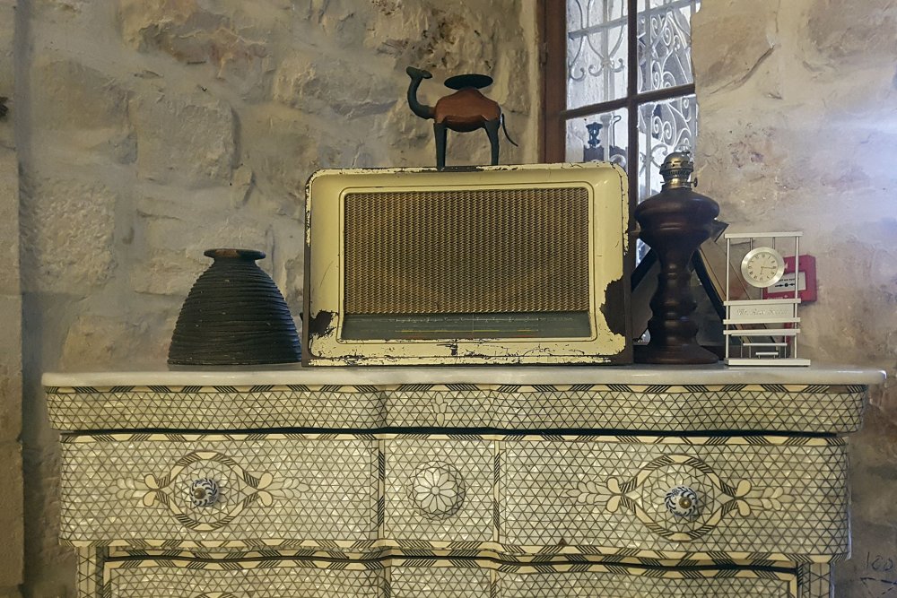 Mother-of-pearl cabinet and antique radio in the Jerusalem Hotel, September 11, 2024