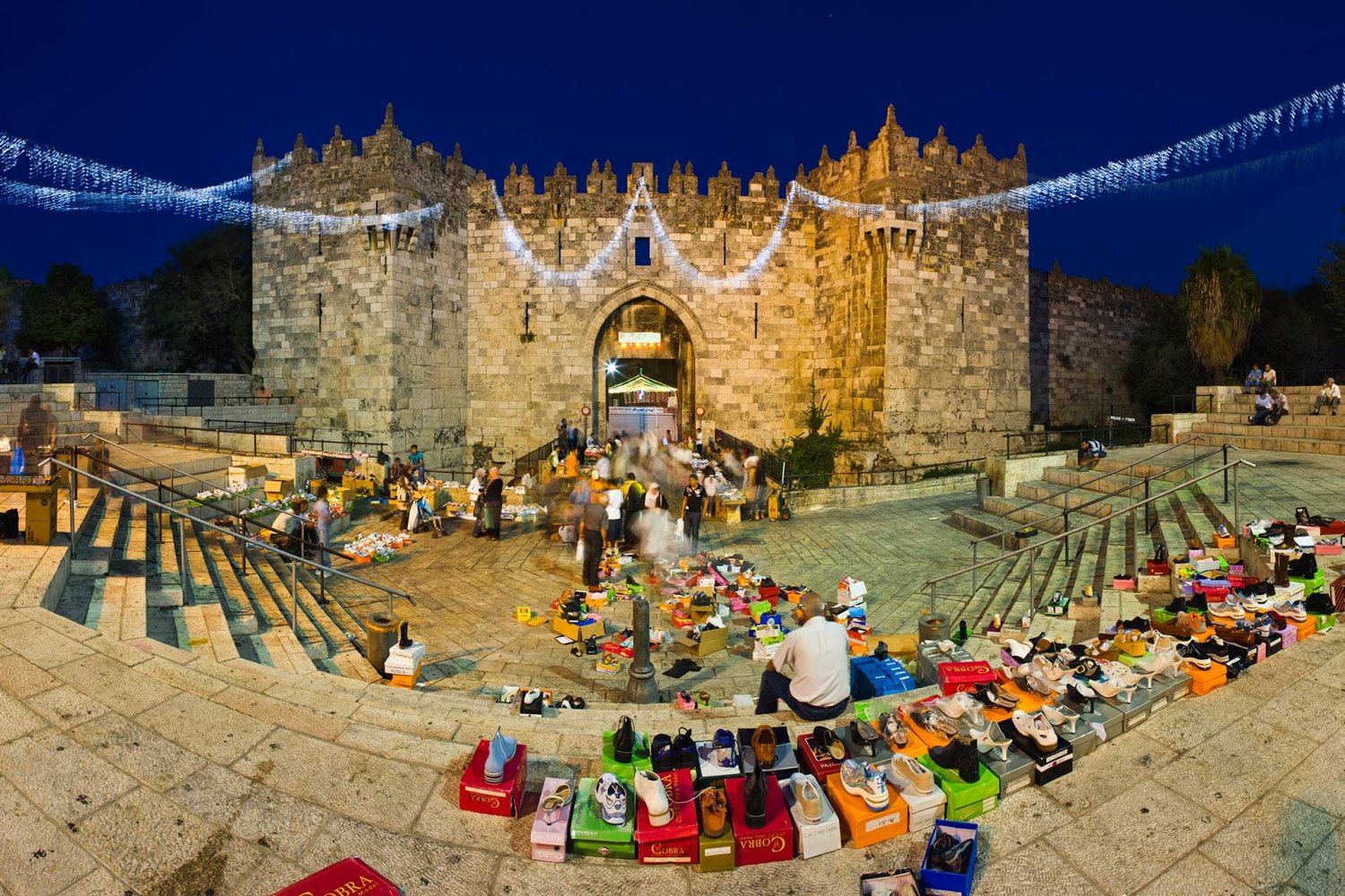 The street market at Jerusalem’s Damascus Gate at dusk during Ramadan, undated