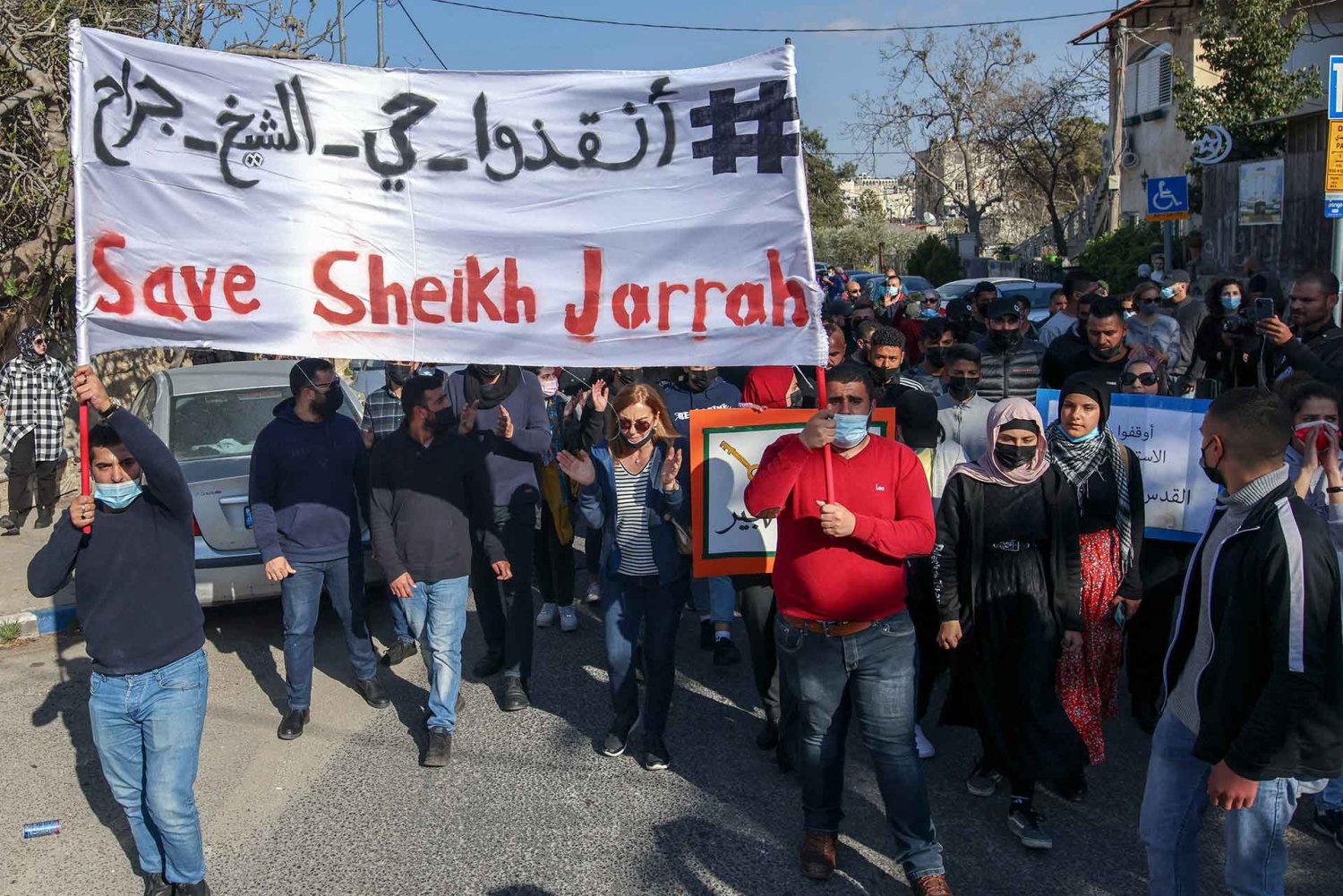 Palestinian, Israeli, and foreign activists demonstrate in Sheikh Jarrah, March 19, 2021.