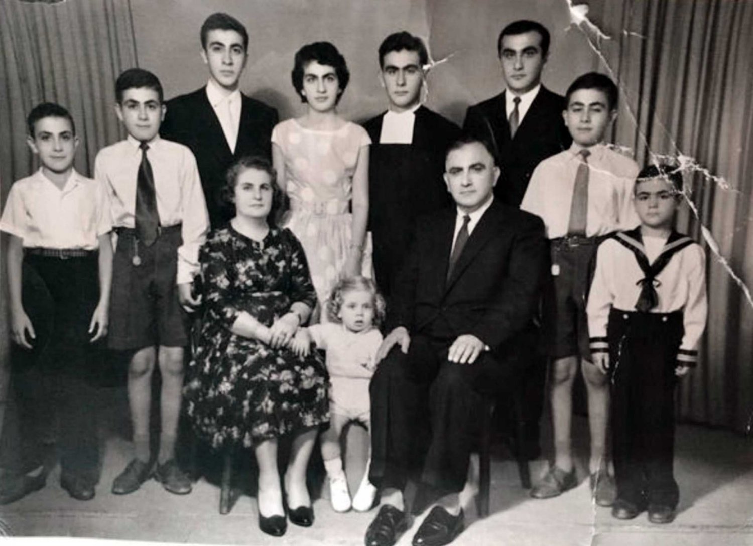 Palestinian composer and organist Augustine Lama with his wife and seven of his nine children, Jerusalem, ca. 1950s