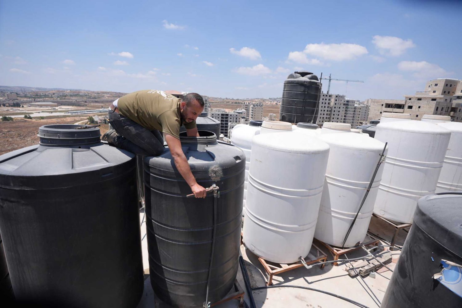 Residents in Kufr ‘Aqab, East Jerusalem, must go to extremes to meet shortages in the city’s water supply.